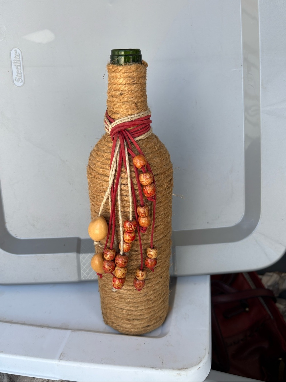 Handcrafted Natural Jute Wrapped Bottle with Red Bead Accent